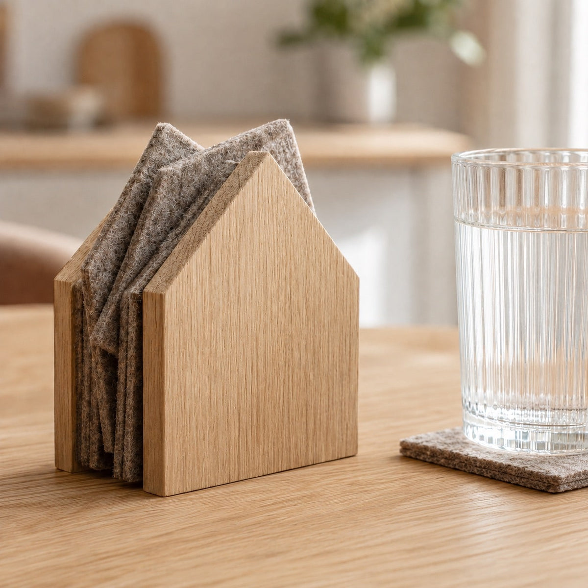 GASTHAUS oak coaster set with a drinking glass in the kitchen