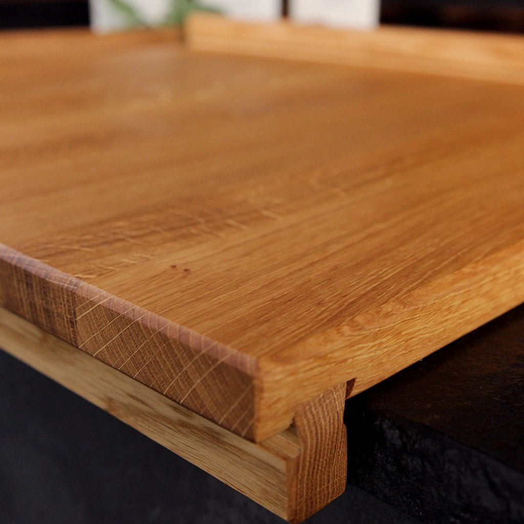 Close-up of the raised front edge on an oak A/B pastry board