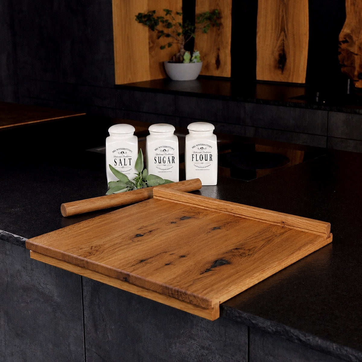 Solid wild oak pastry board with raised edges on a kitchen counter